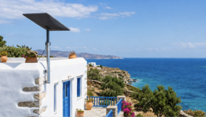 Starlink terminal on a white coastal property in Greece